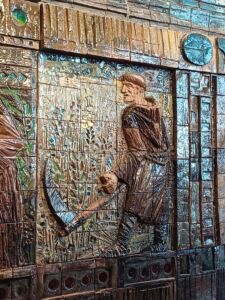 Monje segando en el mosaico del MEGA